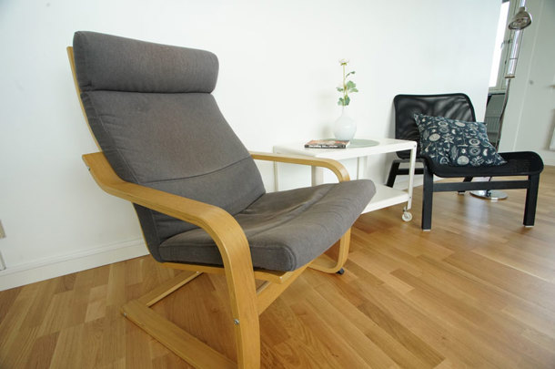 Two armchairs and a small table in the living room
